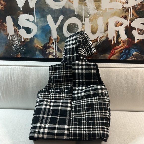 This is a size 14 or a small fit a big kid small man. Reversible Burberry puffer - Picture 6 of 6